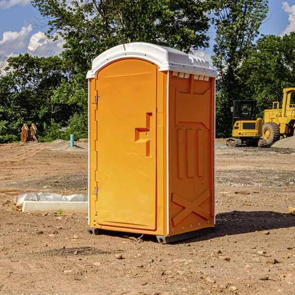 what is the cost difference between standard and deluxe porta potty rentals in Amboy